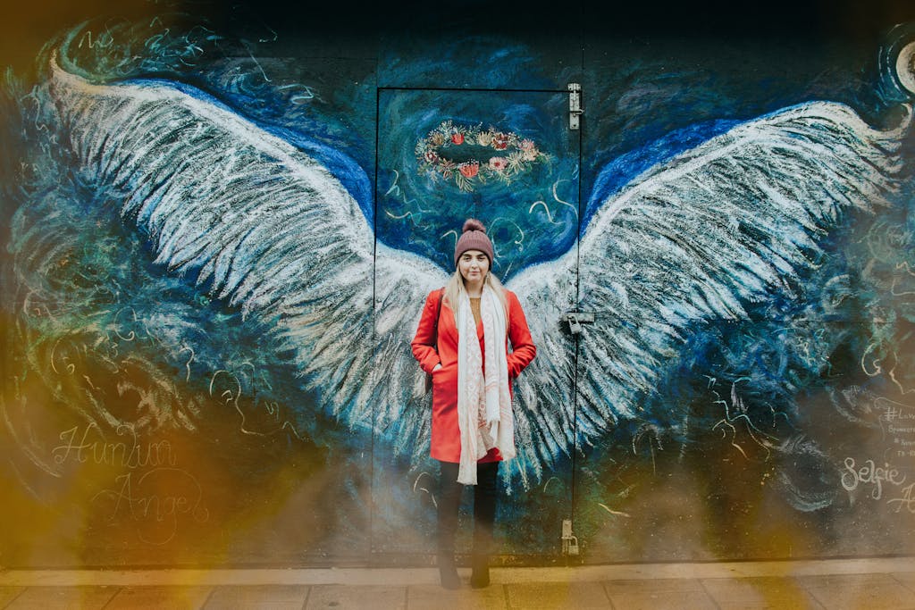 Woman Standing in Front of a Street Art Wall